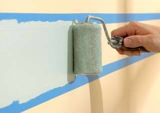 Apply ScotchBlue tape to chair rails and other surfaces to achieve 