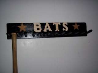 BLACK COLOR FINISH WITH WOOD LETTERS THAT READ BATS AND BROWN STAR 