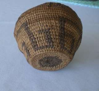   basket. In areas uneven stitching might be the work of a novice