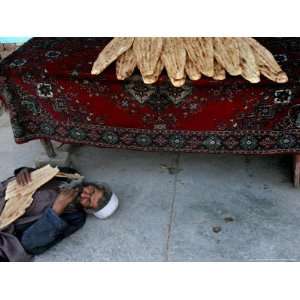  A Beggar Sleeps Next to a Bakery in Kabul, Afghanistan 