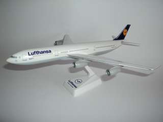 This is a detailed plastic model of an Airbus A340 300 in the colours 