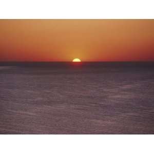  A Brillant Orange Sun Dips Behind the Mediterranean Sea 