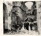 wwii residents of san pietro italy stand amid ruins of