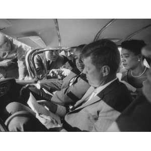 Sen. John F. Kennedy Reading Speech in Car with Naacp Members During 