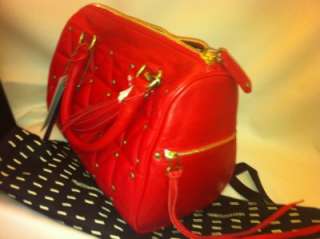  is red leather studded with gold colored studs, inside is black 