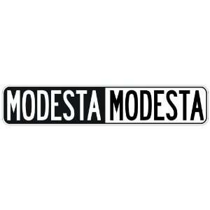   NEGATIVE MODESTA  STREET SIGN