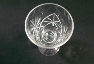 Set of 4 crystal pedestal wine glasses with pinwheel design.