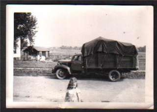 old photo of a 1940s CANVAS COVERED STAKE BED TRUCK  
