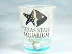 TEXAS STATE AQUARIUM SHOT GLASS 1848 DOLPHINS IN THE GLASS