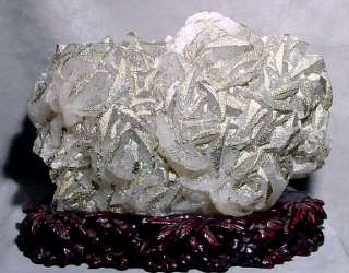 Rainbow hued metallic Chalcopyrite on white Calcite make a stunning 