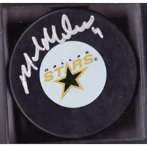 Mike Modano Autographed Hockey Puck   Logo   Autographed NHL Pucks