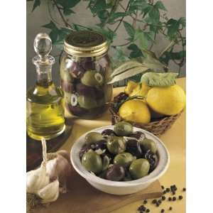  Close Up of Olives with Garlic and a Bottle of Olive Oil 