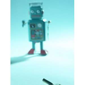 Gray Toy Plastic Robot Walking Towards Key Mechanism Photographic 