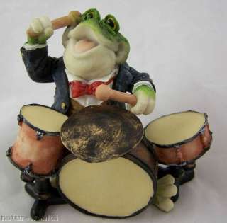 This Drum playing frog is handcrafted and hand painted. He is made of 