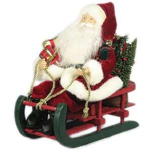   Traditional Santa Sitting on Wooden Sled D01226
